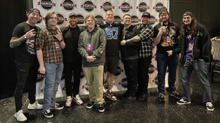 WSOU staff pose with metalcore band, The Ghost Inside.